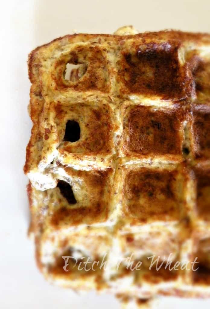 A closeup of healthy banana waffles on a white plate.