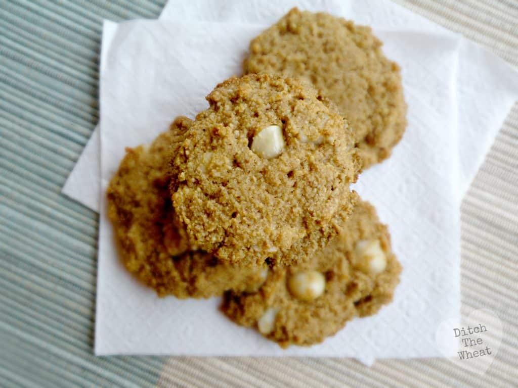 Almond flour macadamia nut cookies in a pile on a napkin.