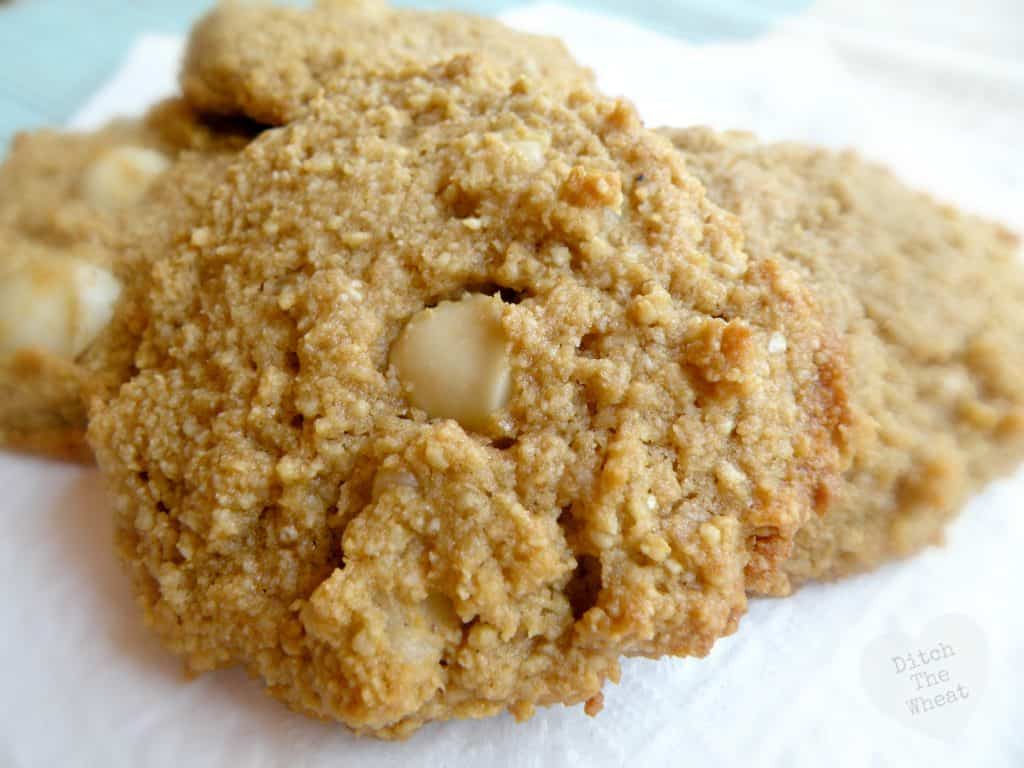 Almond flour macadamia nut cookies in a pile on a napkin.