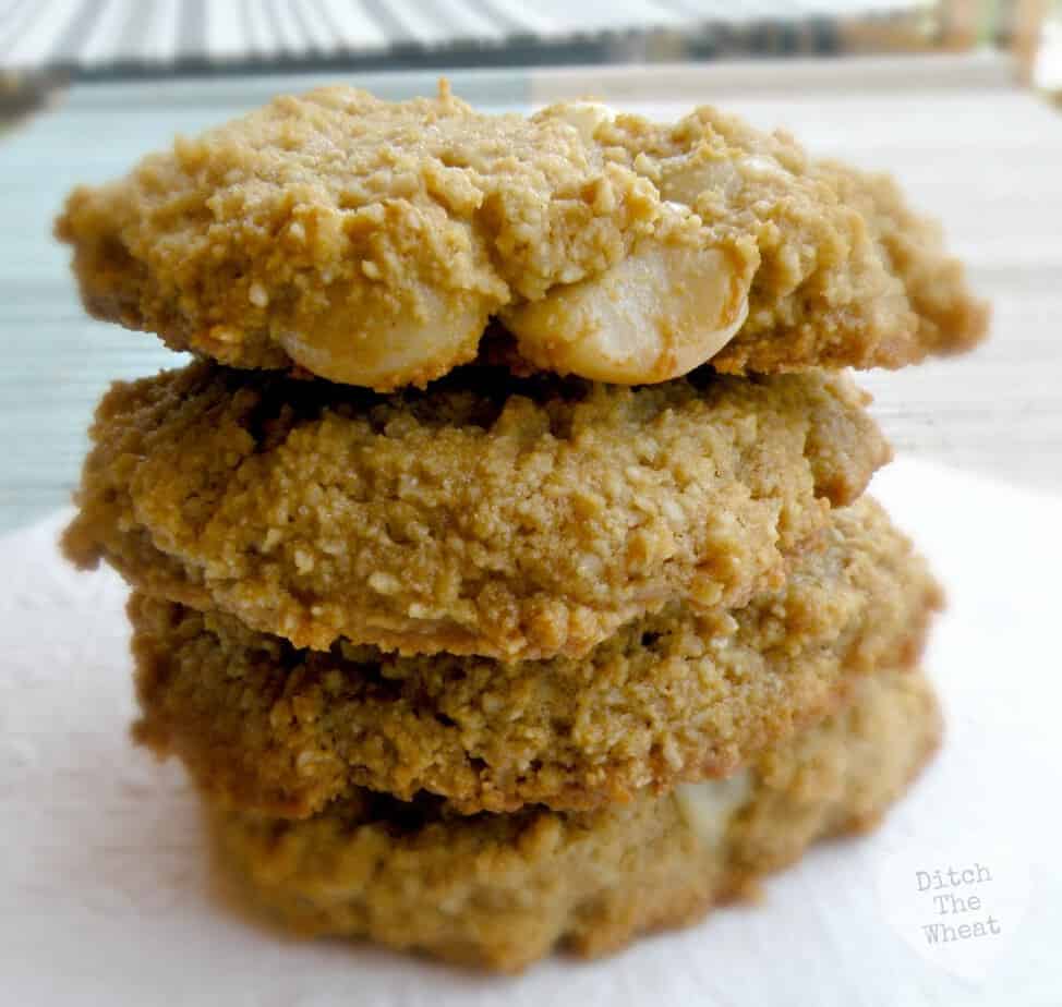 Almond flour macadamia nut cookies in a pile on a napkin.