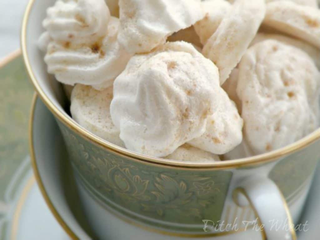 Pumpkin meringue cookies in a tea cup.