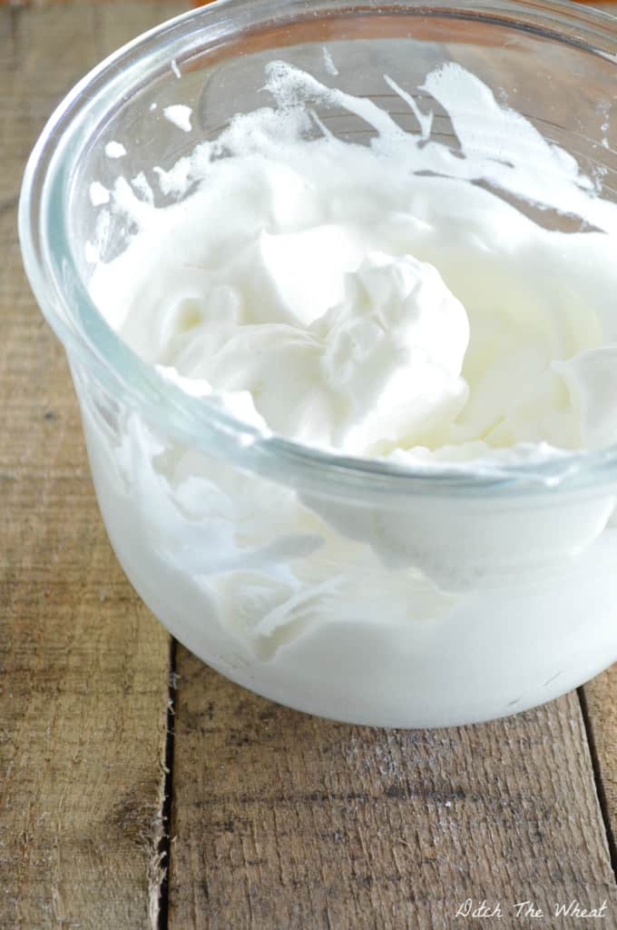 How to Whip Egg Whites: these egg whites have been whipped to stiff peeks.  If you were to take a spatula and pick up the egg whites they would retain their shape.