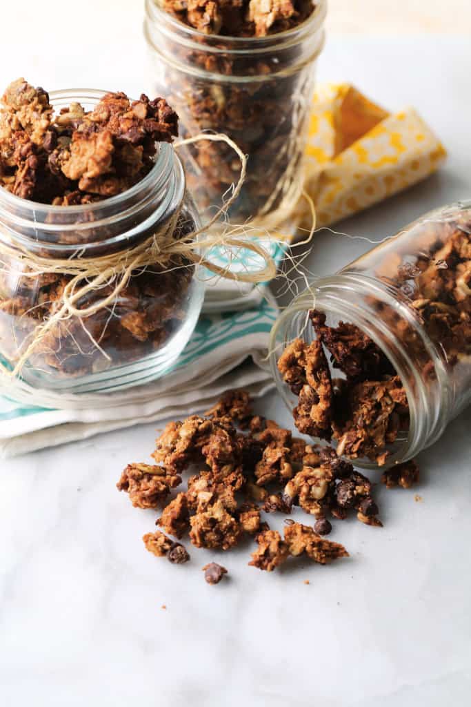 Nut Free Granola spilling out of a jar. 