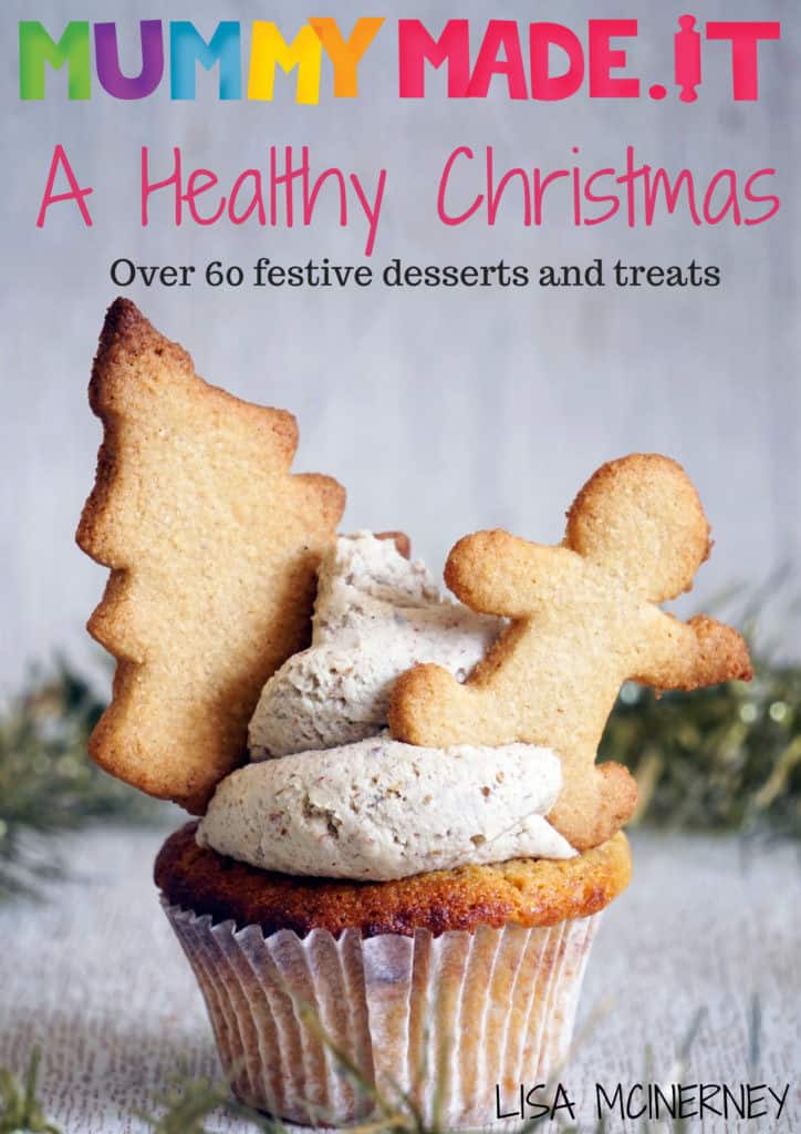 A healthy Christmas cupcake with a gingerbread man cookie and a Christmas tree cookie. 