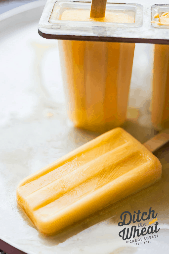 Orange Creamsicle Probiotic Popsicles - This healthy popsicle has no added sugars (great for your kids!) and is dairy-free and perfect for a Whole30 popsicle. Paleo popsicle, paleo cold treats, paleo summer recipes, whole30 popsicle, whole30 cold treats, sugar free popsicles, creamsicle popsicle recipe #paleopopsicle #whole30popsicle #dairyfreepopsicle #sugarfreepopsicle #healthypopsicle
