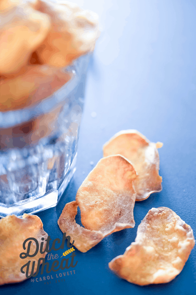 Sweet potato chips spilling out of a jar.