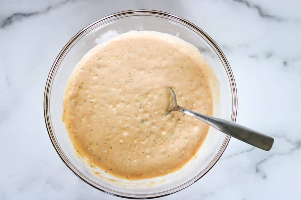 Thousand Island dressing in a bowl with a spoon.