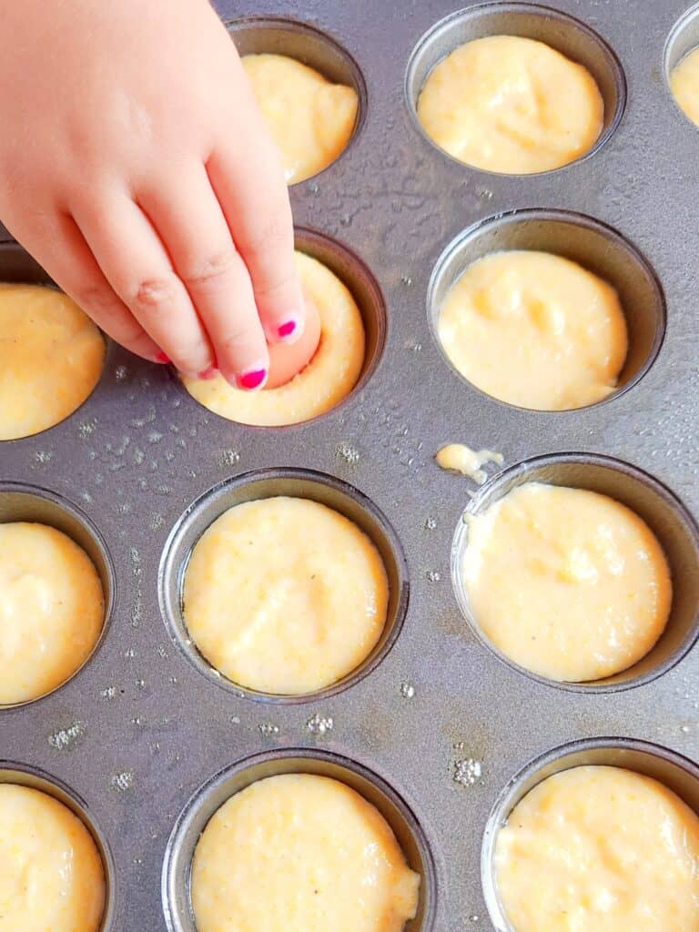 Gluten free corn dog muffins - Press one piece of hot dog into each filled muffin cup. 
