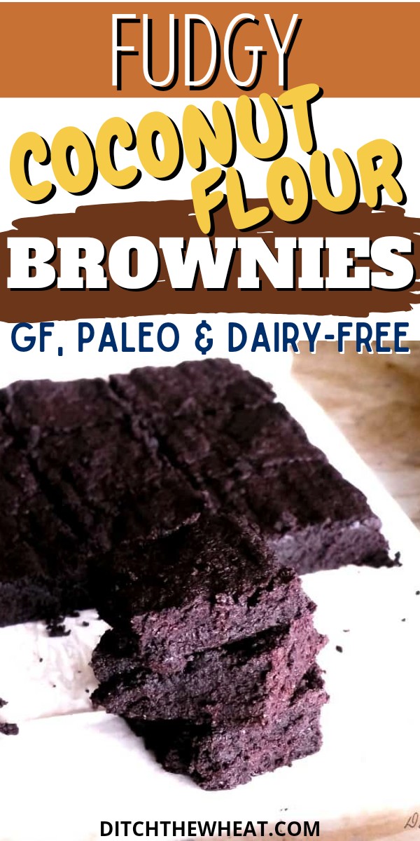 A stack of coconut flour brownies on parchment paper.