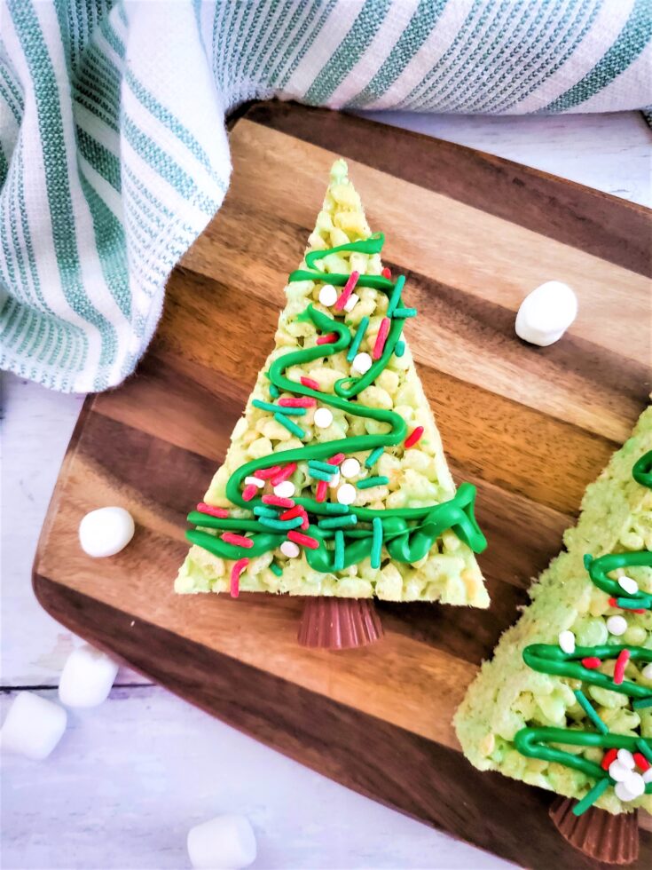 Rice Krispie Christmas Trees on a cutting board