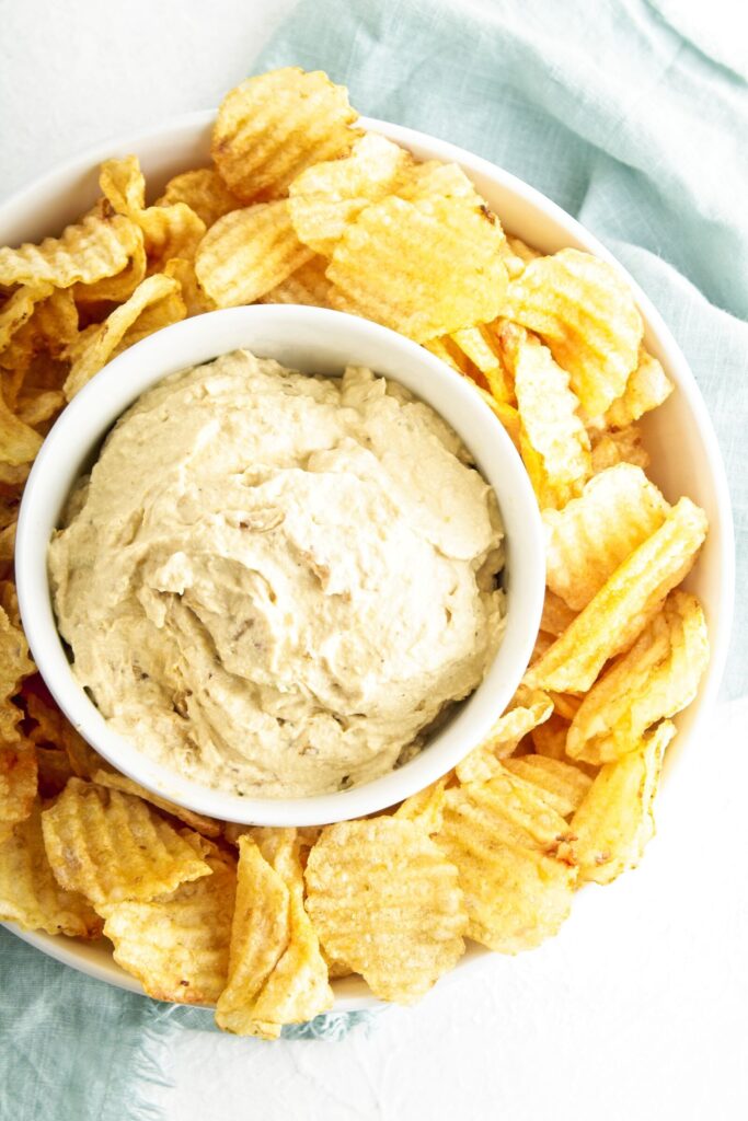 Dairy Free Onion Dip in a bowl with chips.