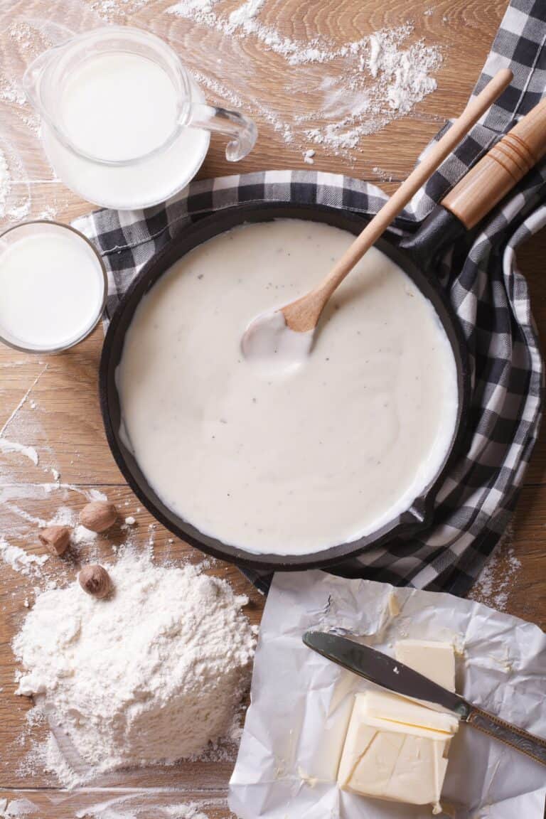 White sauce being thickened in a skillet.