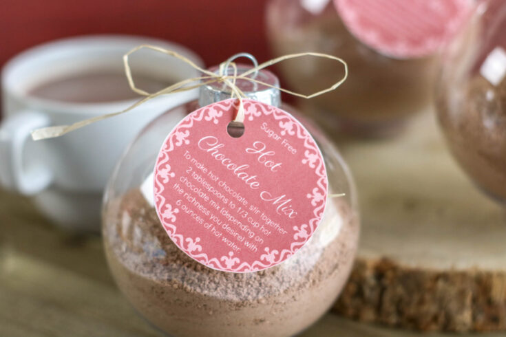 A glass ornament with keto hot chocolate mix.