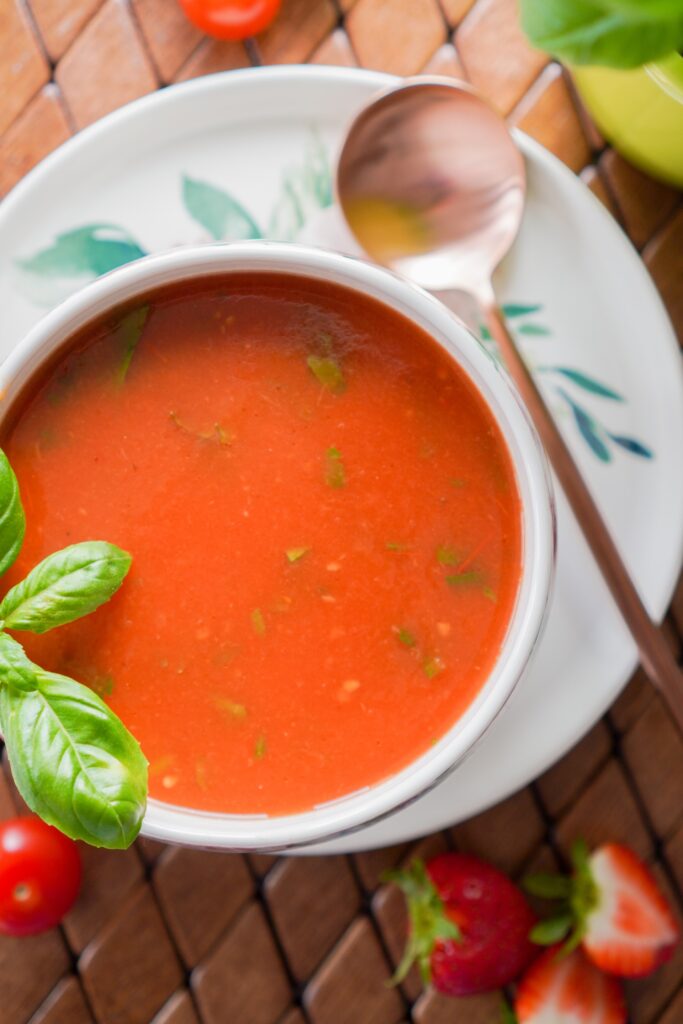 Is tomato sauce gluten free? A bowl of tomato soup with a spoon.