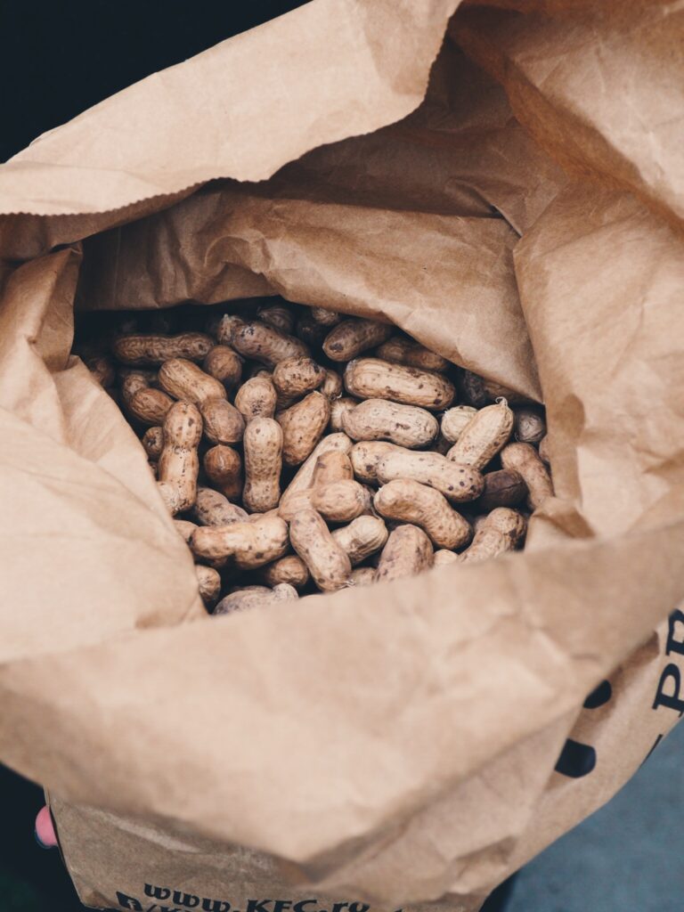 Are peanuts gluten free? Peanuts in their shell in a paper bag.