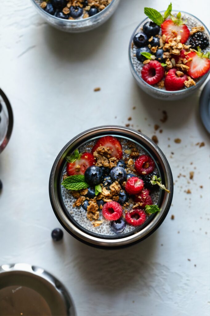 Glutem free lunch ideas for kids. A container of chia seed pudding wit fresh fruit.