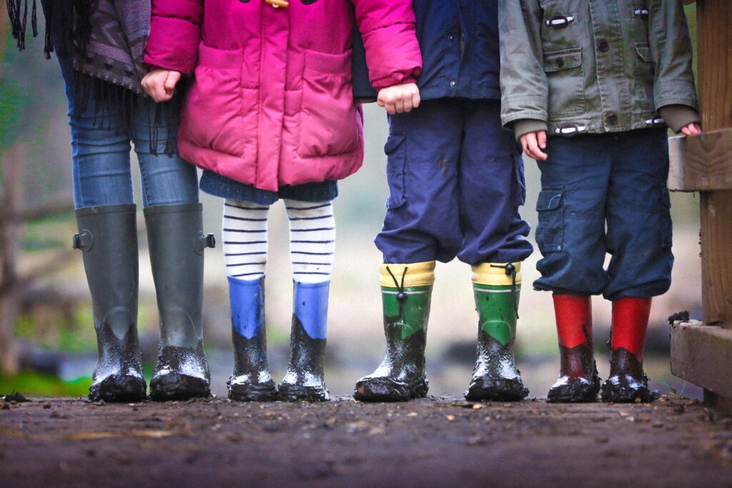 Gluten free lunch ideas for kids. A group of kids are standing outside with rubber boots.