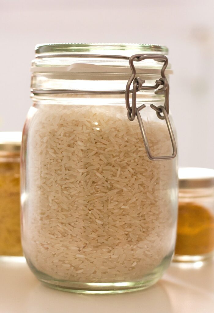 How Much Rice Per Person? A jar of uncooked rice.