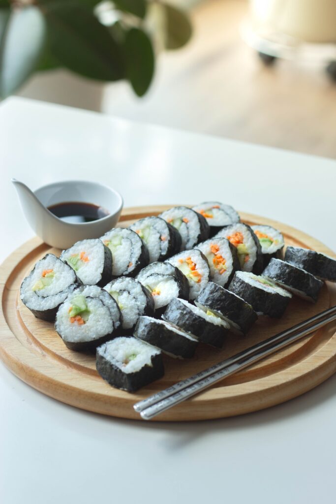 Soy Sauce Substitute. A bowl of soy sauce with sushi.