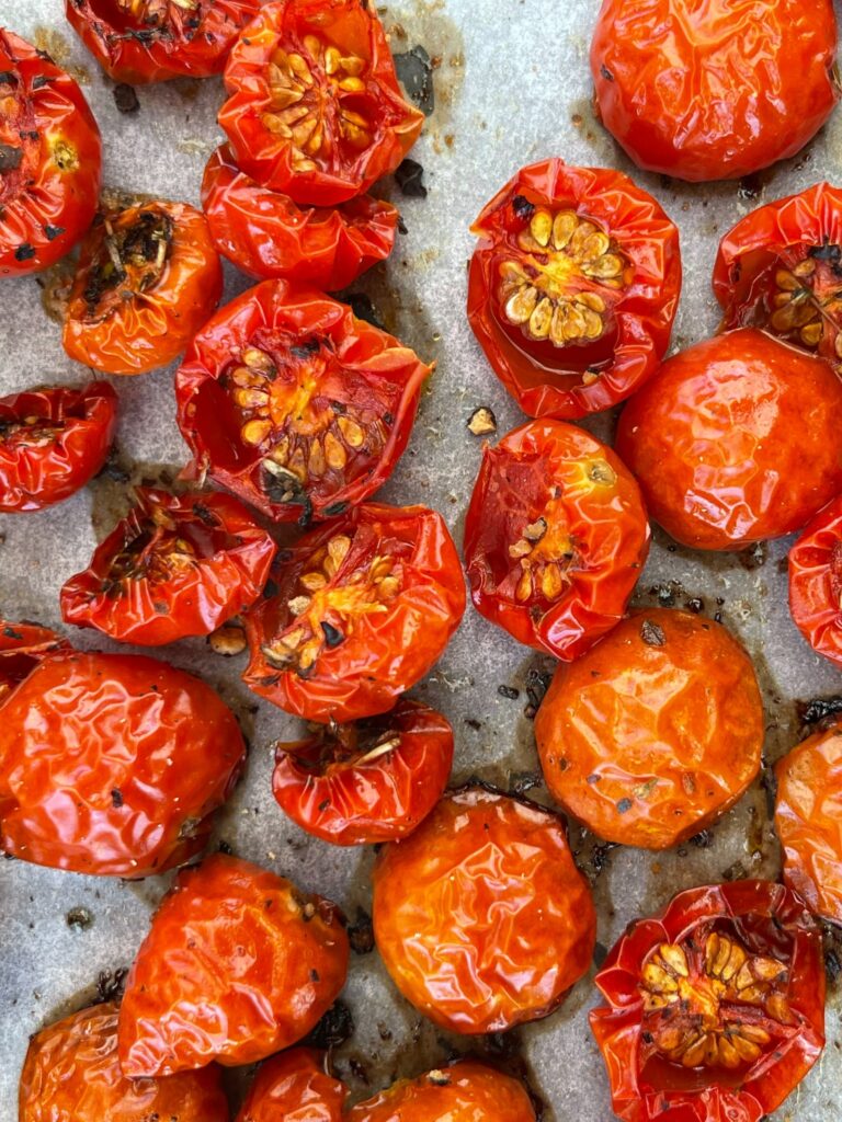 A sheet pan of roasted cherry tomatoes.