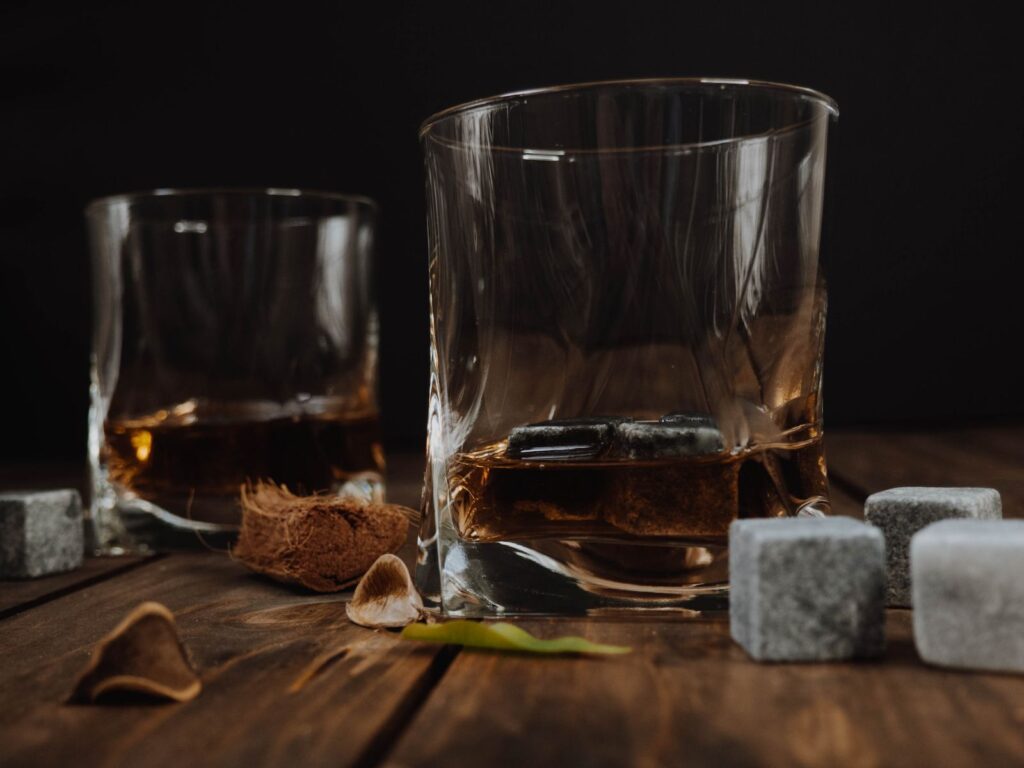 Two glasses with bourbon.