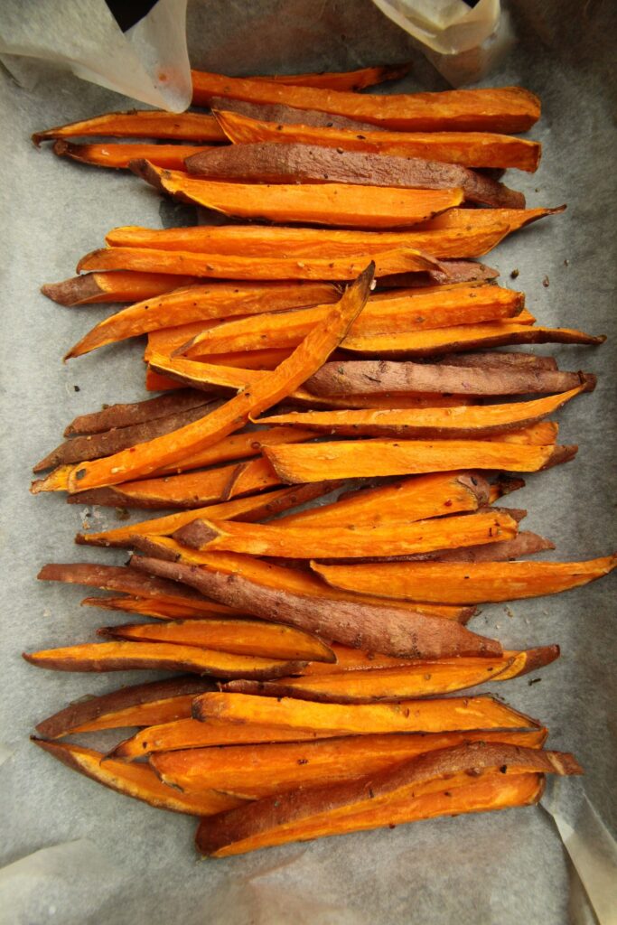 Sweet potato fries on a baking sheet.