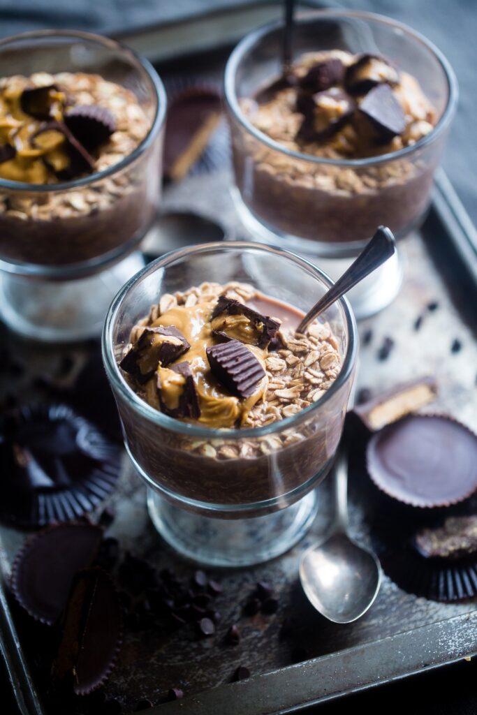Three cups of chocolate peanut butter and oats dessert.