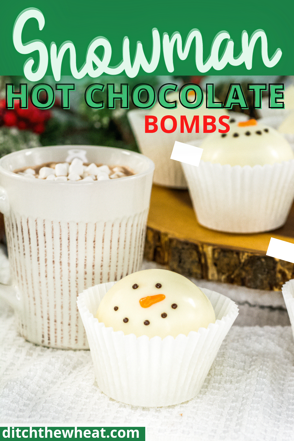 A snowman hot chocolate bomb in a white candy wrapper with hot chocolate in the background.