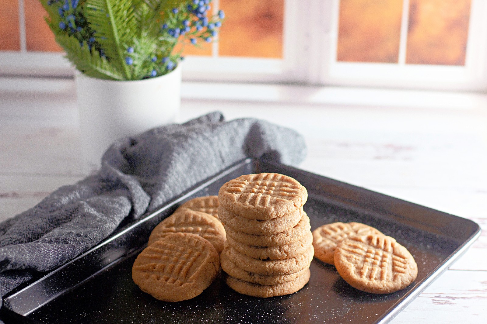 A tray with a stack of gluten free peanut butter cookies