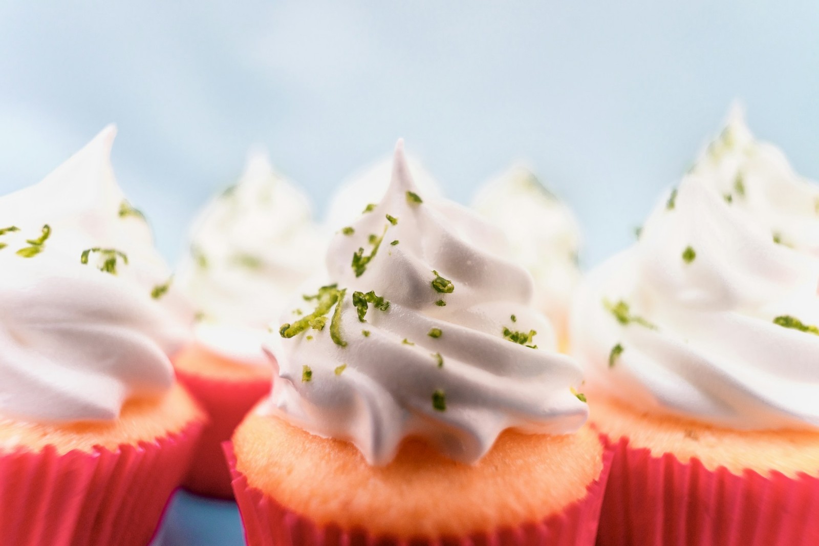 Cupcakes with Whipped frosting and lime zest.