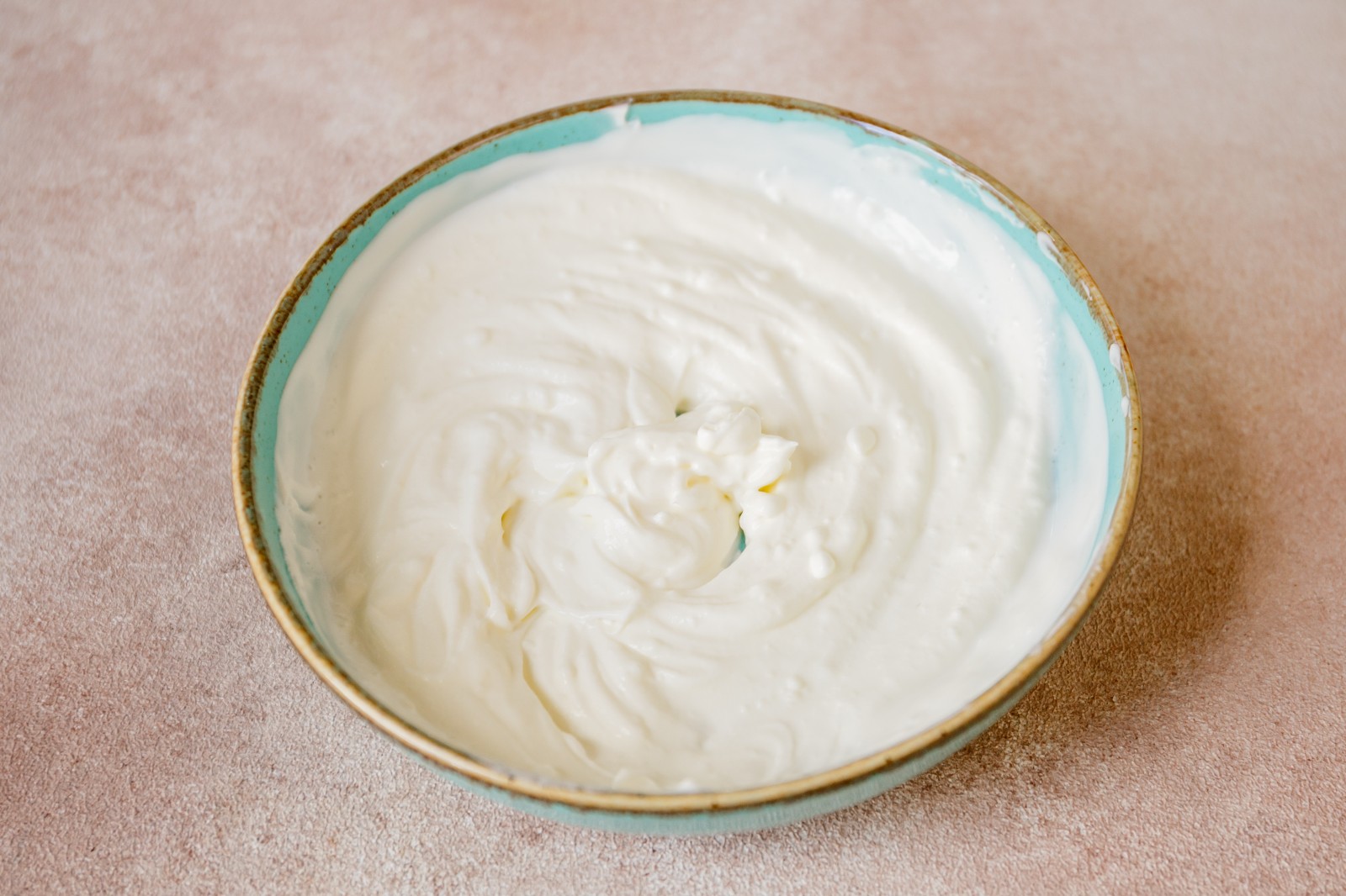 A bowl of whipped cream made from heavy cream.