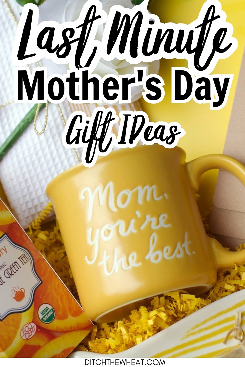 A basket filled with a yellow mug, chocolate, a white rose, and other little gifts.