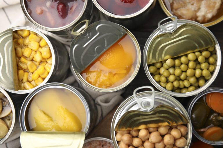 Various opened cans of vegetables and fruit.