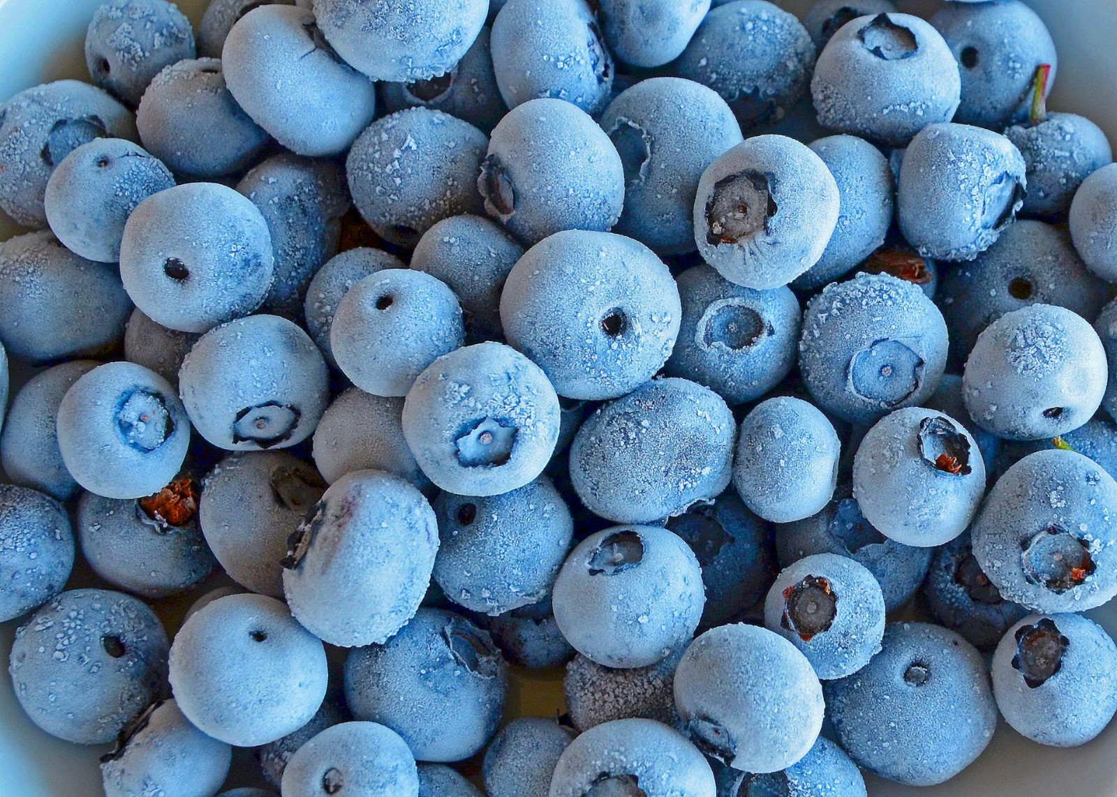 Up close of frozen blueberries.