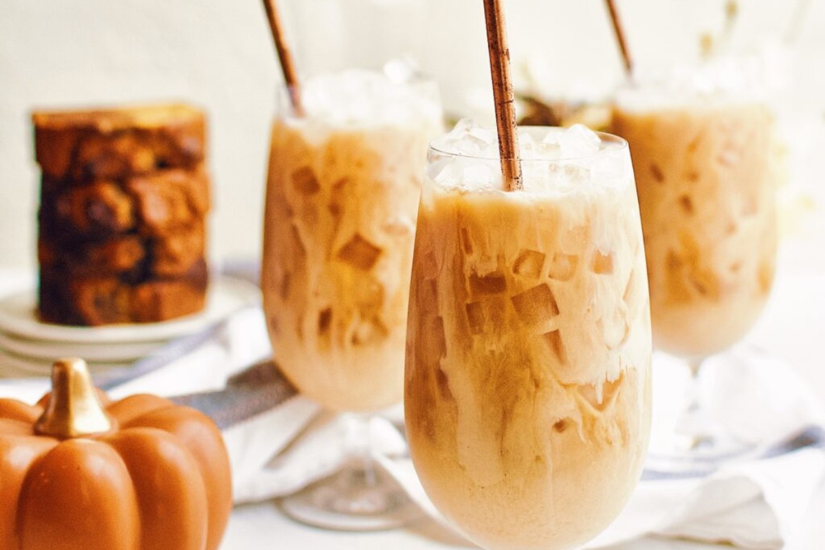 Three glasses filled with Pumpkin Spice Iced Chai Latte.