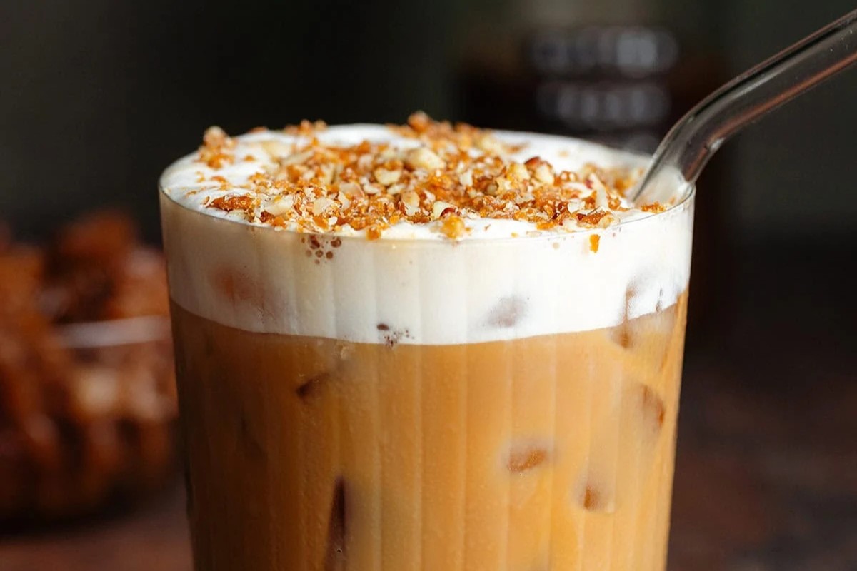 A glass filled with a Starbucks Copycat Pecan Crunch Oat Milk Latte.